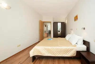 a bedroom with a bed in a room at Sunny Holiday Apartments in Sunny Beach