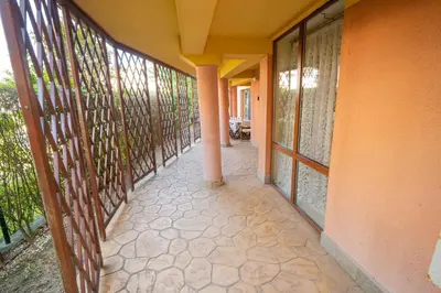 an empty hallway of a house with windows at The Family Courtyard - Very LARGE 2BD Apartment by Flat Manаger in Ravda