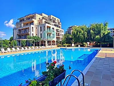 a large swimming pool in front of a building at Sorento Sole Mare in Sveti Vlas