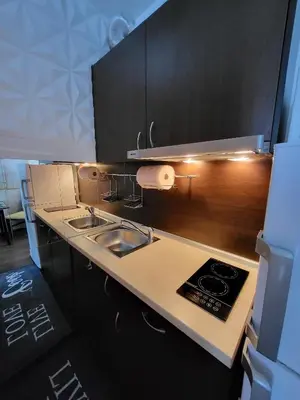 a kitchen with a sink and a counter top at Sunny View SP apartments in Bŭnzareto