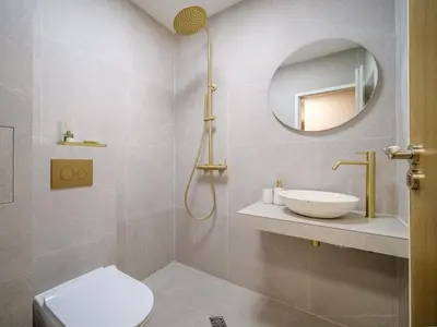 a bathroom with a sink and a toilet and a mirror at BellaViaStay, Flat Apolonia 1BD in Burgas City