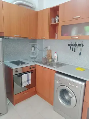 a kitchen with a washing machine and a dishwasher at 3 room apartment Sanny Day 2 in Sunny Beach