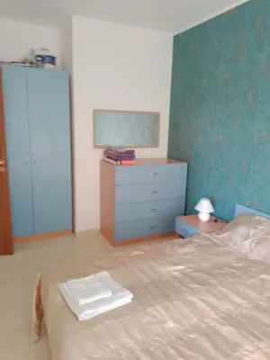 a bedroom with a bed and a dresser and a mirror at 3 room apartment Sanny Day 2 in Sunny Beach