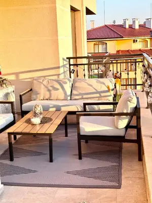 a patio with two couches and a table on a balcony at Sorrento E 4 4 Sveti Vlas in Sveti Vlas