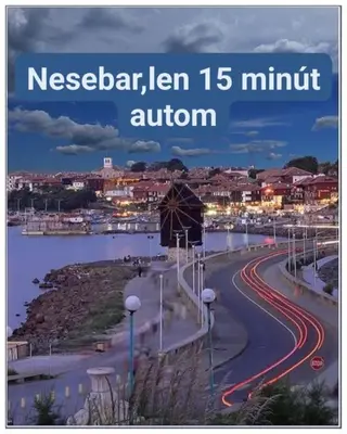 a city street with cars driving down a road at Grand rezort Marína Beach in Sveti Vlas