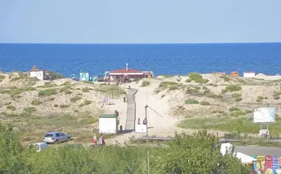 a group of people standing on a hill near the ocean at Apartment Stoyanovi in Primorsko