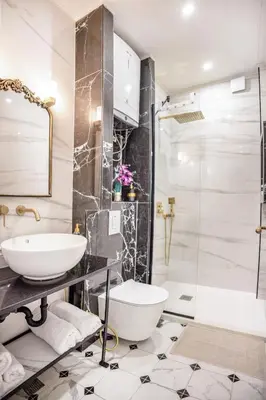 a bathroom with a sink and a toilet and a shower at Downtown Central point Varna Apartment in Varna City