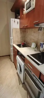 a small kitchen with a stove and a microwave at Palazzo Sunny beach in Sunny Beach