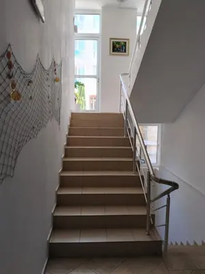 a staircase in a building with a stair case at 2 Room Apartment Costa Calma Aheloy Bulgarien in Aheloy