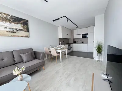 a living room with a couch and a table at Valentina Apartment in Burgas City