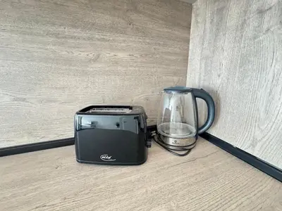 a blender and a toaster sitting on a counter at Valentina Apartment in Burgas City