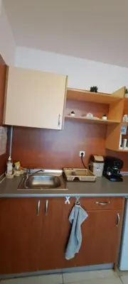 a kitchen with a sink and a counter top at Grand Кameliq - MORSKI BRIZ apartment in Sunny Beach