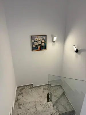 a room with a glass table and a picture on the wall at Aurum Villas Smokinya Beach 2 in Sozopol