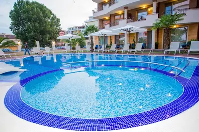 a large blue swimming pool in a hotel at Boutique Apart Hotel Versis in Sunny Beach