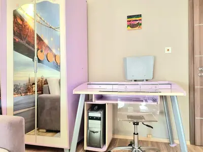 a desk with a computer on it in a room at Aquapark 2BD Apartment for Family in Sunny Beach
