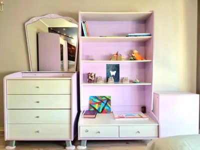 a pink bedroom with a dresser and a mirror at Aquapark 2BD Apartment for Family in Sunny Beach
