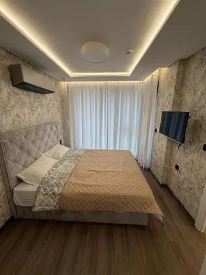 a bedroom with a bed and a television in it at Sea Home 8 in Sunny Beach