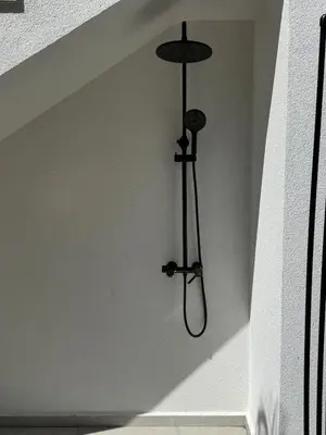 a light hanging from a wall in a room at Sea Home 8 in Sunny Beach