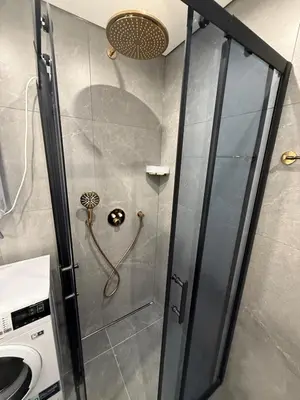 a shower with a glass door in a bathroom at Sea Home 8 in Sunny Beach