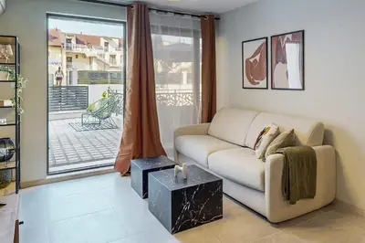 a living room with a couch and a window at BellaViaStay, Flat Thalassa 1BD in Sozopol