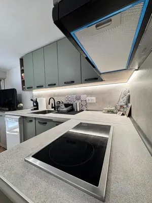 a kitchen with a sink in the middle of a counter at Studio Briz in Burgas City
