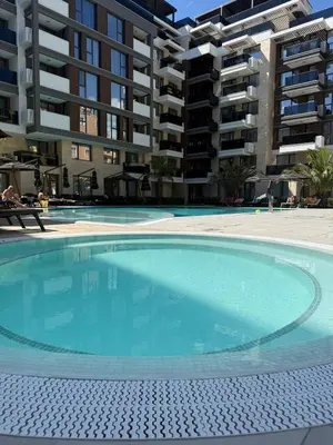 a large swimming pool in front of a building at Sea Home 9 in Sunny Beach