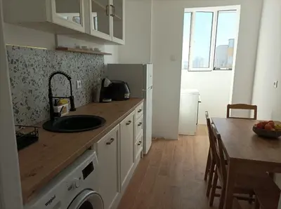 a kitchen with a sink and a wooden counter top at Sunrise home in Burgas City