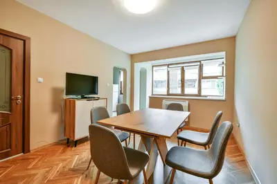 a dining room with a table and chairs at Central location 2BR - 6 guests in Varna City