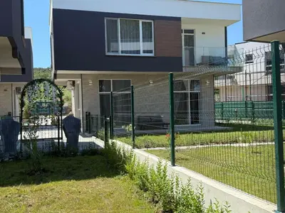 a fence in front of a house at Aurum Villas Smokinya Beach 3 in Sozopol