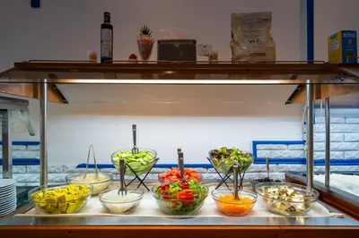 a buffet line with bowls of different types of vegetables at MPM Hotel Condor - All Inclusive Light in Sunny Beach