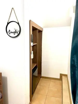 a hallway with a door to a room at Centrino in Burgas City
