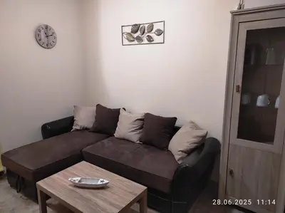a living room with a couch and a table at Blue Beach Apartments - Melia in Ravda