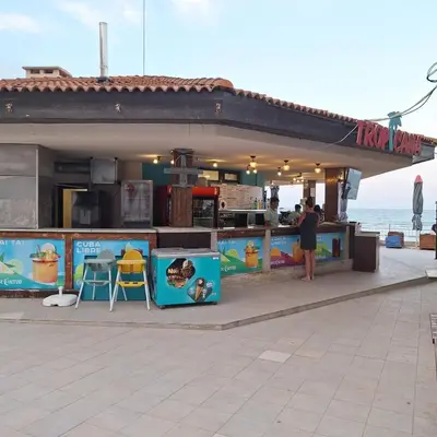 a food stand on the beach next to the ocean at Panoramic sea view at the beach in Obzor