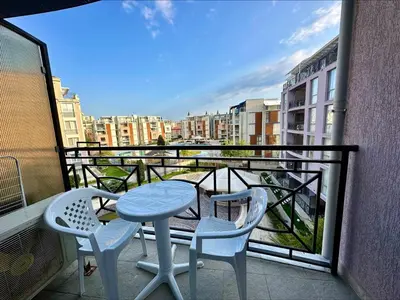a table and two chairs on a balcony with a view at Rainbow 3 - Menada Apartments in Sunny Beach