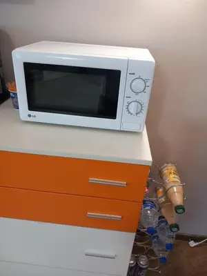 a microwave oven sitting on top of a counter at Силви Съни Бийч Плаза in Sunny Beach
