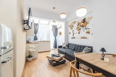 a living room with a couch and a table at California in Varna City