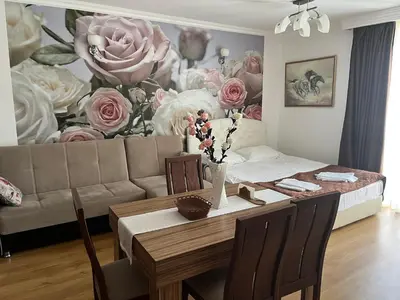 a living room with a table and a couch at Apart Sweet Homes 5 - Apartments for guests in Sunny Beach