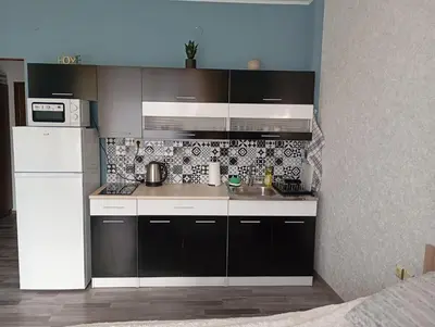 a kitchen with a sink and a refrigerator at Sunshine2 in Sunny Beach
