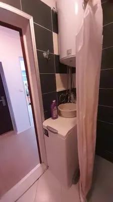 a small bathroom with a toilet and a sink at 2 Room Apartment Gallery with Poolview in Sunny Beach