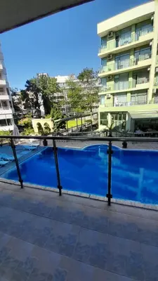 a view from the balcony of a building at 2 Room Apartment Gallery with Poolview in Sunny Beach