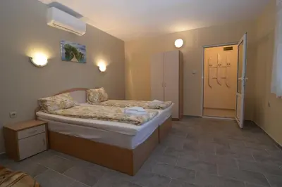 a bedroom with a large bed in a room at Atlantic Complex Ravda in Ravda