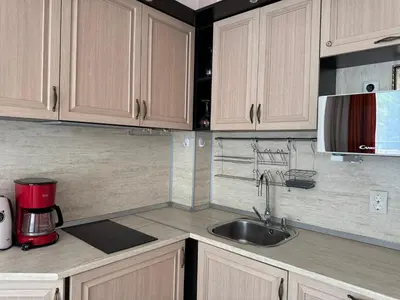a kitchen with a sink and a microwave at VP Villa Valencia in Sunny Beach
