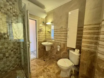 a bathroom with a toilet and a sink at VP Villa Valencia in Sunny Beach