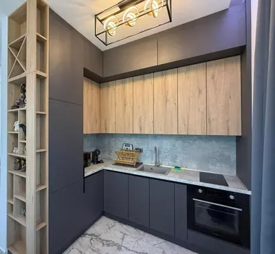a kitchen with gray cabinets and a sink at Aurum Villas Smokinya Beach 4 in Sozopol