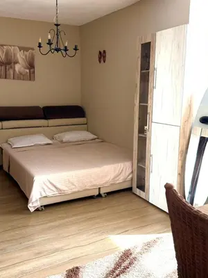 a bedroom with a bed and a sliding glass door at Apartment in Desi's house in Obzor
