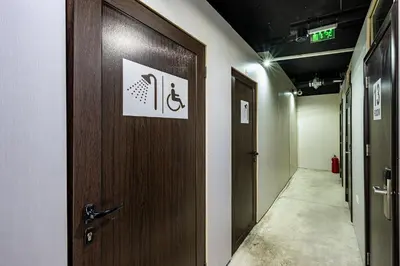 a hallway with a wooden door in a room at Heart of the city Hostel in Varna City