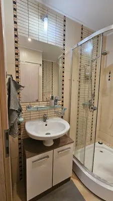 a bathroom with a sink and a shower at Studio Vanita in Sozopol
