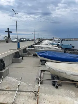 a bunch of boats are parked next to a pier at Atlantic in Pomorie