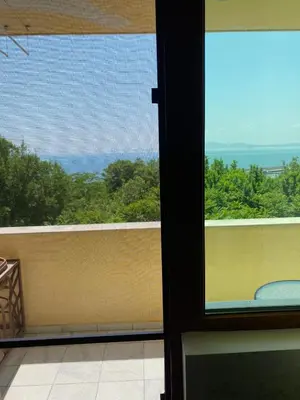 a view of the ocean from a balcony at Стаи за гости Денкови in Burgas City