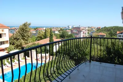 a balcony with a view of a swimming pool at Studio Juli in Lozenets